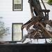 An excavator crane dumps debris and wreckage into a dumpster at the site of a demolition at First Street and Kingsley Street on Monday. Daniel Brenner I AnnArbor.com